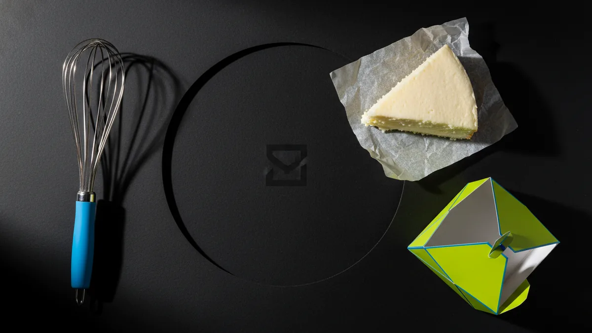 Baking tools and a cake slice arranged neatly for brand design inspiration