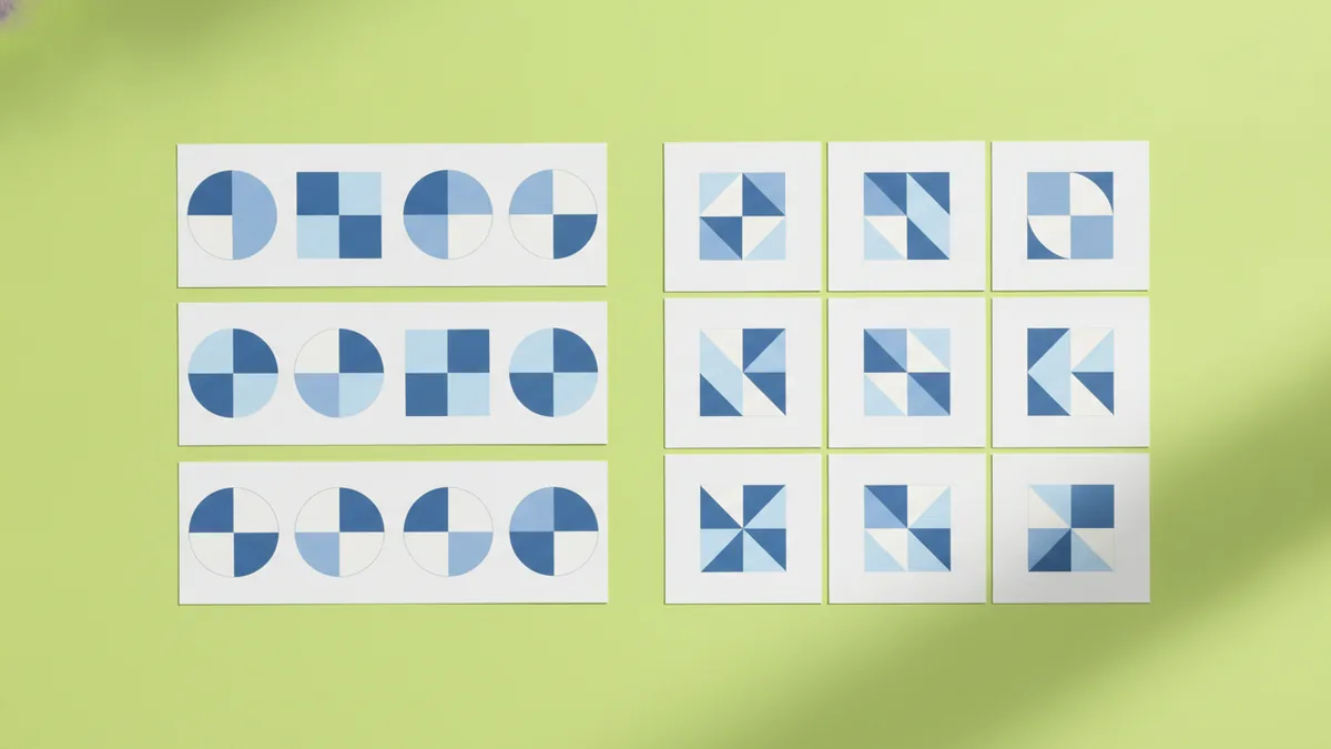 Printed logo references laid out to compare style and typography