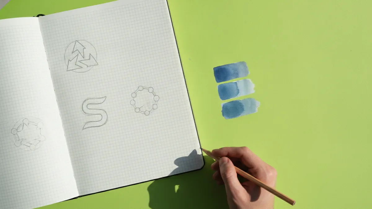 Sketch thumbnails and color swatches for creating a business logo
