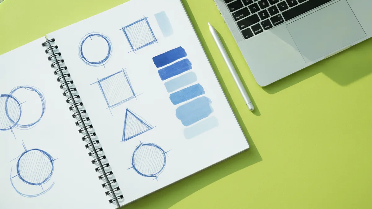 Sketching your clan concept Notebook sketches and color swatches for planning a clan logo design.