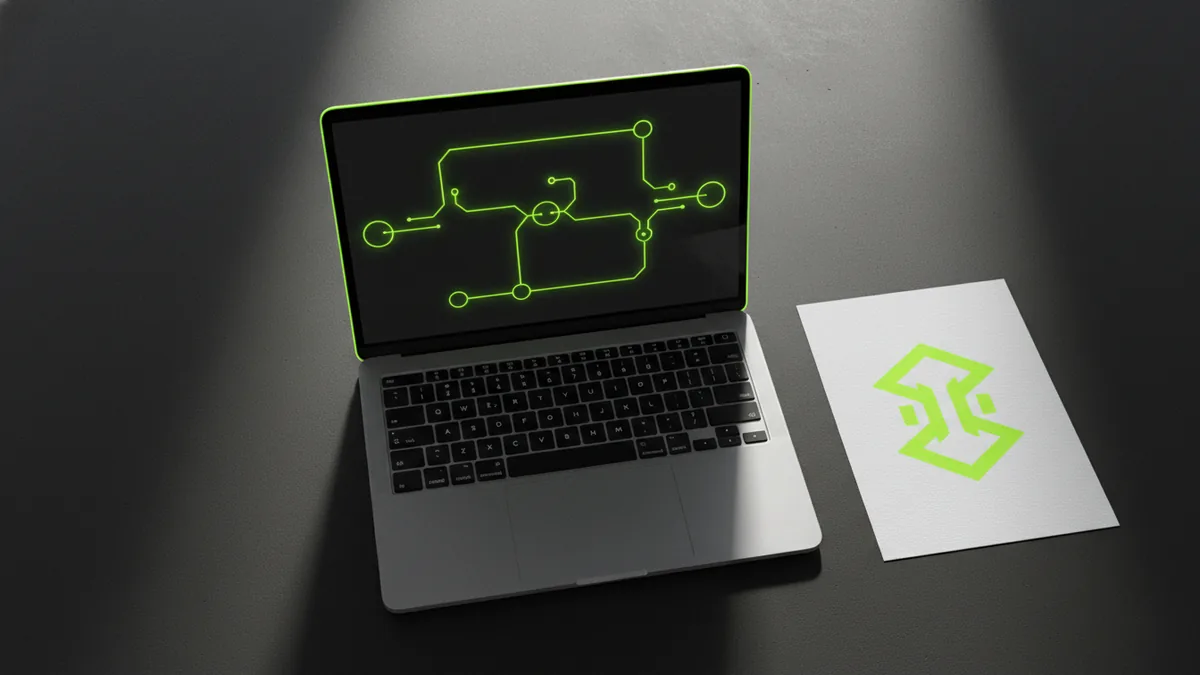Laptop and logo assets arranged for creating a short intro video
